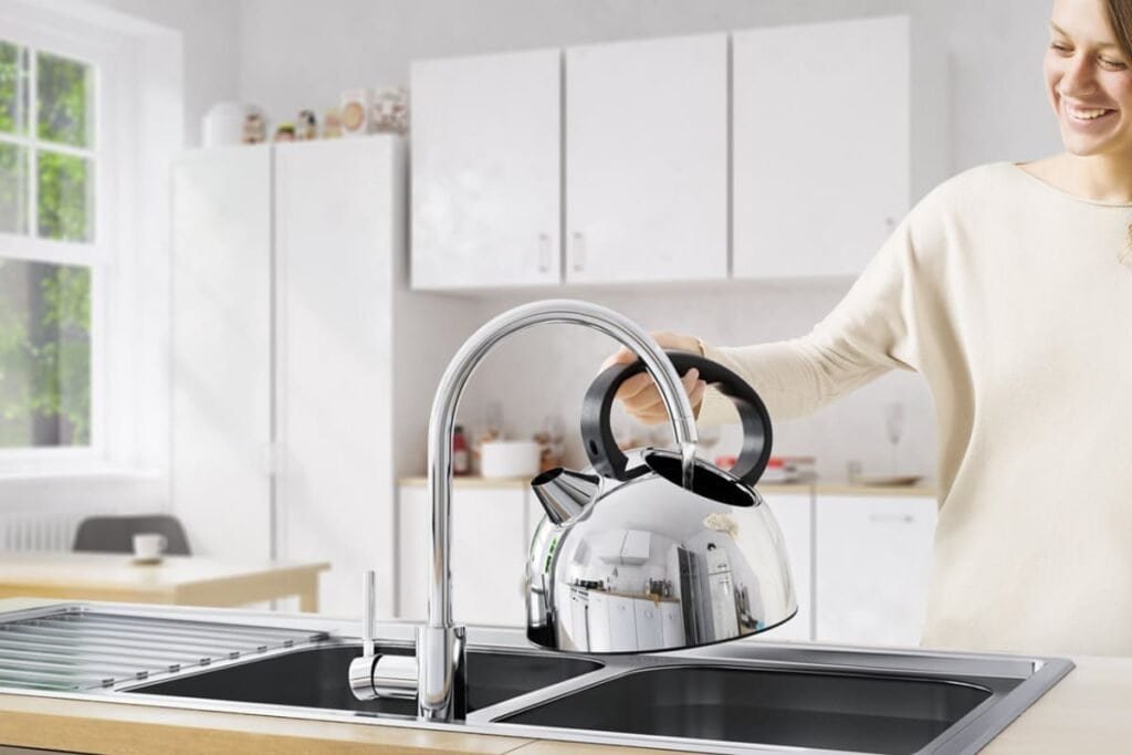 Pregnant woman using lead-free healthy faucet